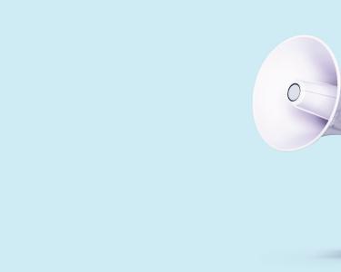 White megaphone with red accents floating on a pale blue background.