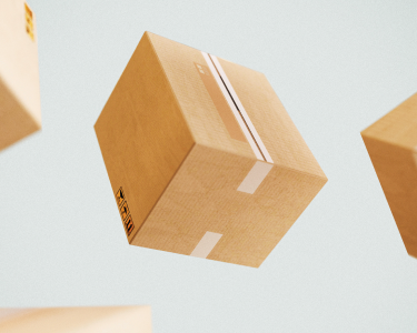 Cardboard boxes suspended against a blue background.