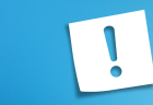 An exclamation point on a white sticky note with a blue gradient background.
