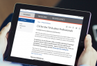 Closeup of someone reading about a cortical visual impairment training on the Perkins School for the Blind website.