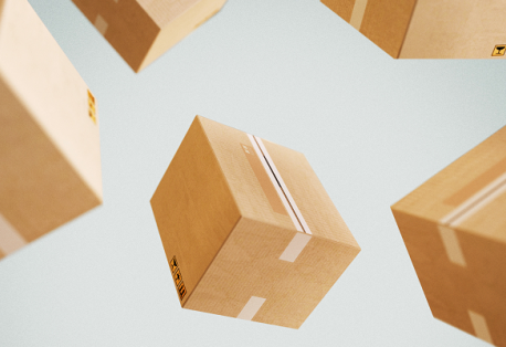 Beige shipping boxes are suspended in midair against a gray background.