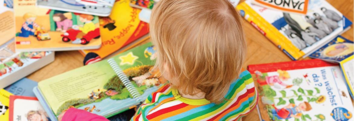 Toddler with books
