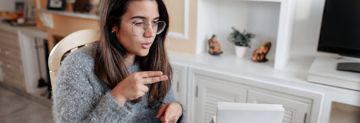 A woman using American Sign Language