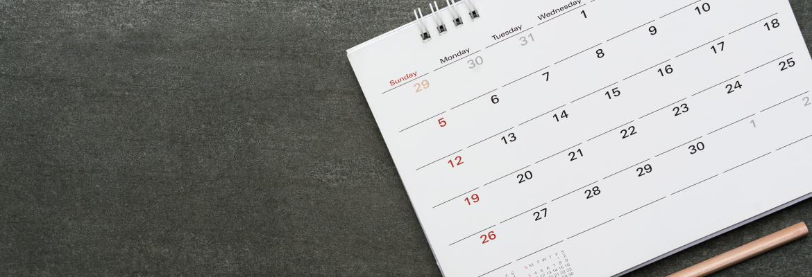 A calendar on a grey background.