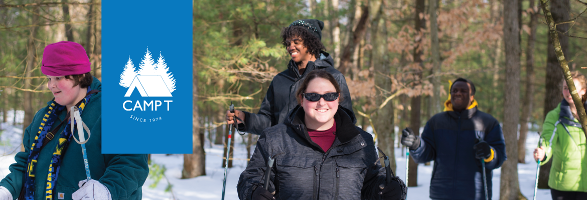 A group of five teens snowshoeing in a wintry forest. A Camp T logo is placed over the image.