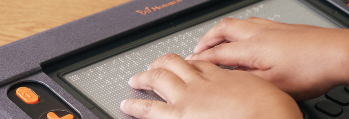 A childs hands on the Monarch tablet