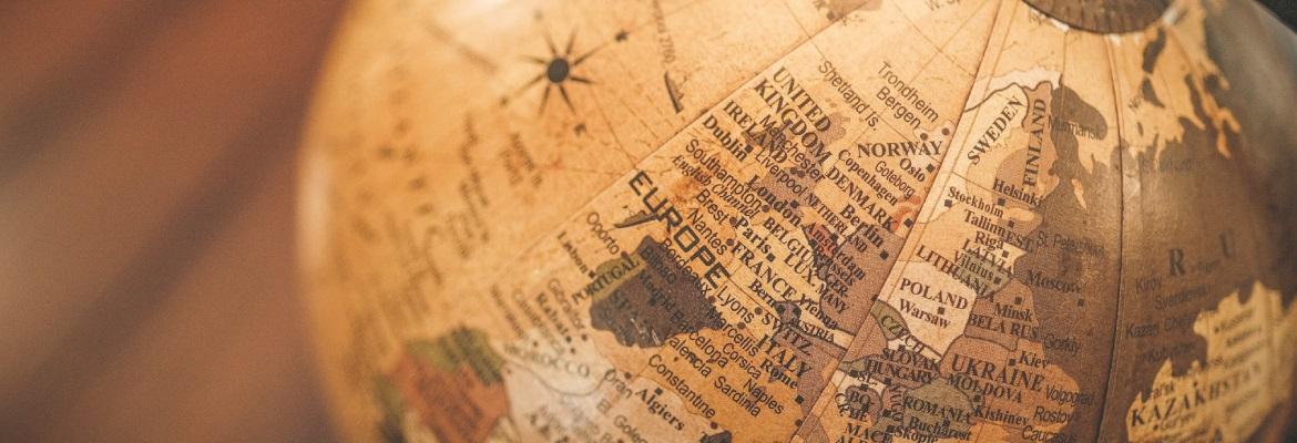 Closeup of a world globe in brown tones.