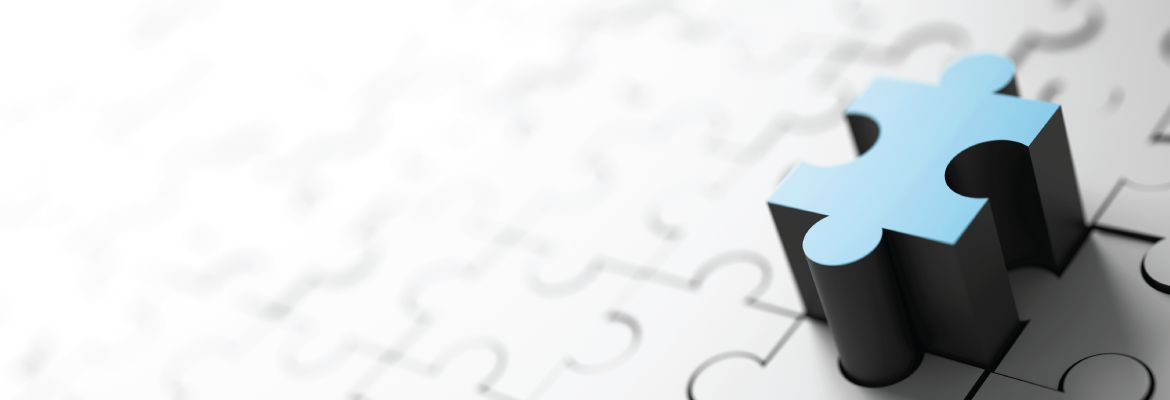 A blue puzzle piece poised to complete a puzzle.